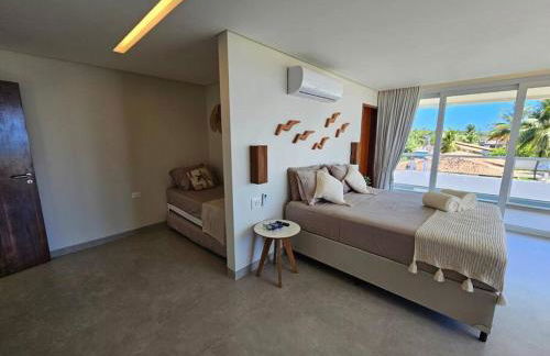 Piscina aquecida, 5 suítes e pé na areia com vista espetacular!! - Photo 23