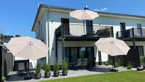 8 Personen Ferienhaus ,,Seegelblick" am Goitzschesee, erste Reihe am Strand mit Sauna, Whirlpool, Kamin, Wallbox & SUP - Foto 2