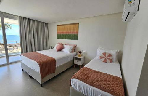 Piscina aquecida, 5 suítes e pé na areia com vista espetacular!! - Photo 36