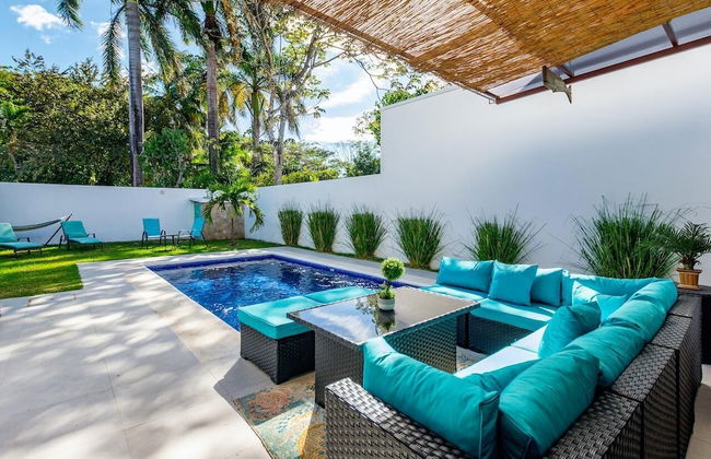 Ultramodern Townhome with an Inviting Coastal Design and Lush Outdoor Oasis with a Private Pool - Photo 1