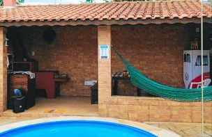 Casa Espaço Sara Piscina com total privacidade, área gourmet completa com churrasqueira fogão a lenha, a 5min do centro e do parque das águas - Foto 50