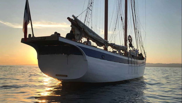Sailing the coast of Marseille at dusk