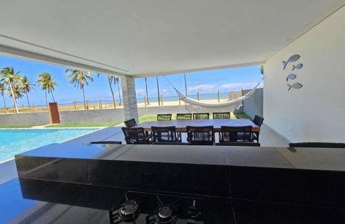 Piscina aquecida, 5 suítes e pé na areia com vista espetacular!! - Photo 11