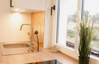 Modernes Ferienhaus mit 4 separaten Appartements, je mit vollausgestatteter Küchenzeile und eigenem Bad, 2 Gehminuten zum Badesee, Garten, Grillplatz, Kinderspielbereich, Hunde sind willkommen - Foto 14