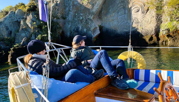 Marveling at the Maori rock carvings