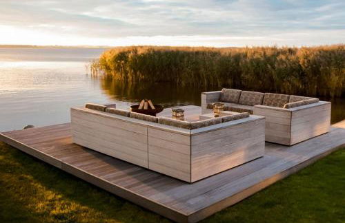 Ferienhaus Peeneblick - exklusives Traumhaus in Direktlage am Wasser mit Bootssteg und Aussensauna - Foto 3