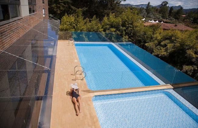 MG Hotels & Suites - Photo 1