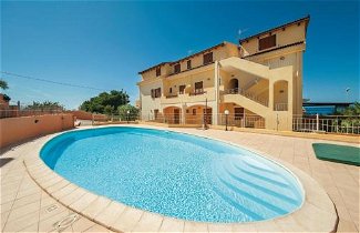 Foto 1 - Apartamento en Castelsardo con piscina y vistas al mar